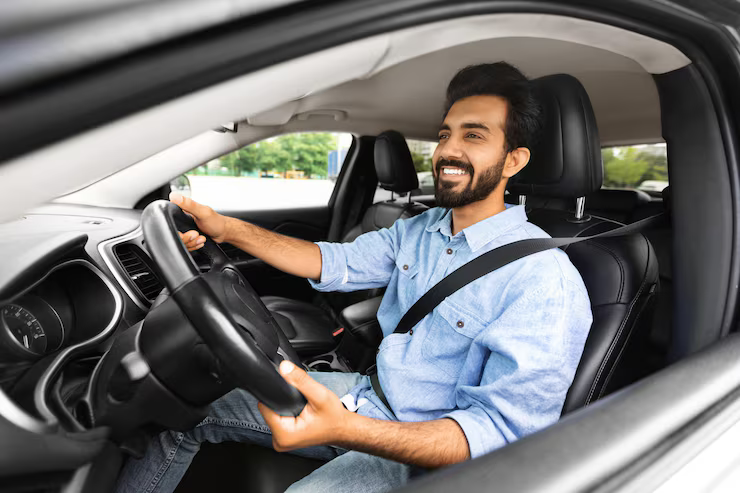 positive-young-indian-man-sitting-car-driver-seat_116547-81805